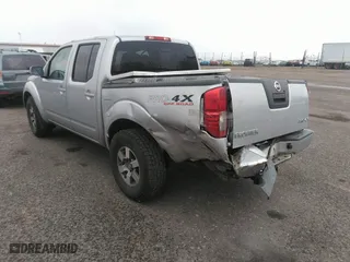 2011 Nissan Frontier PRO-4X with VIN 1N6AD0EV2BC438370, listed as a IAAI auction lot 41952484 with 217,529 mi miles. Bid and sale history available at carsss.com. Image 3.