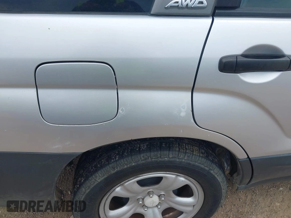 2003 Subaru Forester X with VIN JF1SG63633H743948, listed as a IAAI auction lot 39435958 with 132,774 mi miles. Bid and sale history available at carsss.com. Image 6.