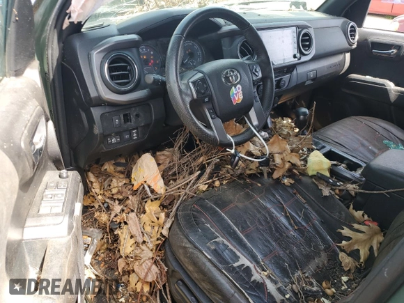 2021 Toyota Tacoma 4WD SR5 with VIN 3TMDZ5BNXMM099474, listed as a Copart auction lot 49325385 with 57,853 mi miles and Salvage Title. Bid and sale history available at carsss.com. Image 8.