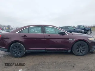 2011 Ford Taurus SE with VIN 1FAHP2DW7BG136988, listed as a IAAI auction lot 42002512 with 145,847 mi miles. Bid and sale history available at carsss.com. Image 6.