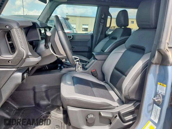 2024 Ford Bronco Big Bend with VIN 1FMDE7BH7RLA03788, listed as a Copart auction lot 65085065 with 10,597 mi miles and Salvage title. Bid and sale history available at DreamBid. Image 7.