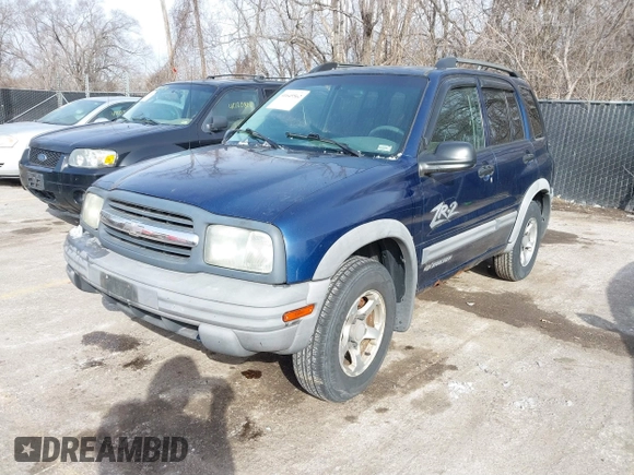 2004 Chevrolet Tracker ZR2 z VIN 2CNBJ734746917149, wystawiony jako IAAI lot #41649562 z przebiegiem 216 092 mil mil oraz . Historia ofert i sprzedaży dostępna na DreamBid. Obrazek 2.
