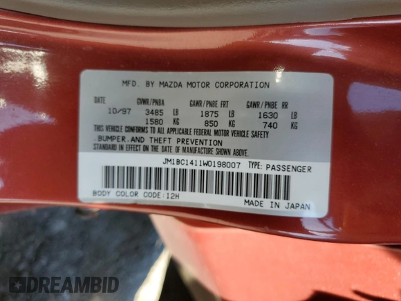 1998 Mazda Protege DX z VIN JM1BC1411W0198007, wystawiony jako Copart lot #46941185 z przebiegiem 101 696 mil mil oraz Szkoda całkowita • Salvage title. Historia ofert i sprzedaży dostępna na DreamBid. Obrazek 13.
