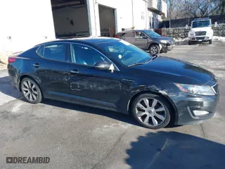 2012 Kia Optima SX with VIN 5XXGR4A64CG005414, listed as a IAAI auction lot 41079632 with 154,655 mi miles. Bid and sale history available at carsss.com. Image 1.