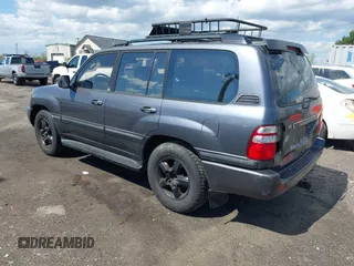 2003 Toyota Land Cruiser z VIN JTEHT05J932041288, wystawiony jako IAAI lot #42000615 z przebiegiem 166 159 mil mil oraz . Historia ofert i sprzedaży dostępna na DreamBid. Obrazek 3.