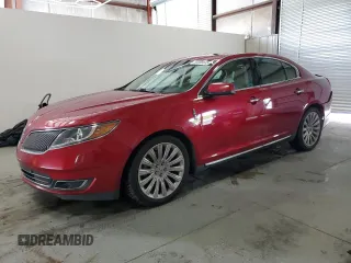 2014 Lincoln MKS with VIN 1LNHL9DK1EG612342, listed as a Copart auction lot 59285635 with 106,427 mi miles and Salvage title. Bid and sale history available at DreamBid. Image 1.