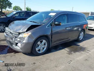 2012 Honda Odyssey Touring with VIN 5FNRL5H95CB057346, listed as a IAAI auction lot 42644094 with 114,712 mi miles and . Bid and sale history available at DreamBid. Image 18.