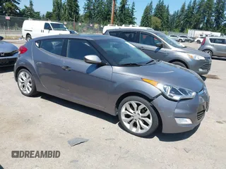 2012 Hyundai Veloster w/Black Int with VIN KMHTC6AD5CU030788, listed as a IAAI auction lot 42774337 with 104,297 mi miles and . Bid and sale history available at DreamBid. Image 1.