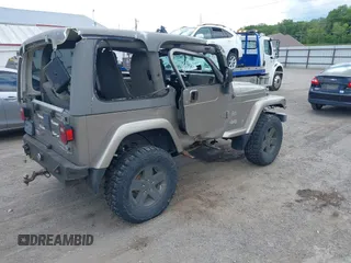 2004 Jeep Wrangler Sahara with VIN 1J4FA59S54P740417, listed as a IAAI auction lot 42382078 with 200,108 mi miles and . Bid and sale history available at DreamBid. Image 4.