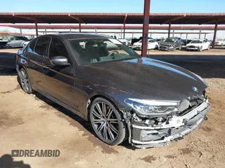 2018 BMW 5 Series 540i xDrive with VIN WBAJE7C50JG891354, listed as a IAAI auction lot 41507602 with 28,470 mi miles and . Bid and sale history available at DreamBid. Image 1.