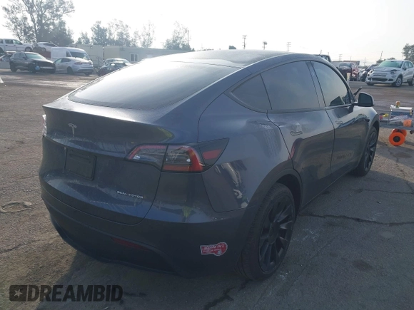 2023 Tesla Model Y Long Range with VIN 7SAYGDEE7PA196038, listed as a IAAI auction lot 41459601 with 16,489 mi miles and . Bid and sale history available at DreamBid. Image 4.