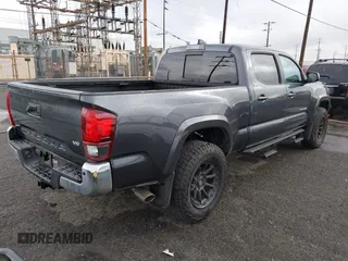 2022 Toyota Tacoma SR5 with VIN 3TMBZ5DN2NM034561, listed as a IAAI auction lot 40867443 with 51,728 mi miles and . Bid and sale history available at DreamBid. Image 4.