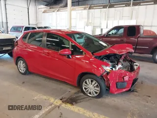 2015 Honda Fit LX z VIN 3HGGK5H57FM741551, wystawiony jako IAAI lot #42384705 z przebiegiem Nie podano mil oraz . Historia ofert i sprzedaży dostępna na DreamBid. Obrazek 1.