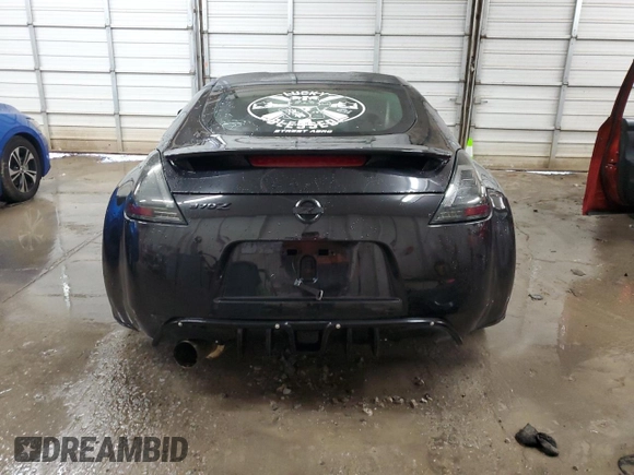 2009 Nissan 370Z z VIN JN1AZ44EX9M407193, wystawiony jako Copart lot #84891734 z przebiegiem 129 296 mil mil oraz Szkoda całkowita • Salvage title. Historia ofert i sprzedaży dostępna na DreamBid. Obrazek 6.