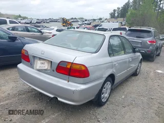 2000 Honda Civic VP with VIN 2HGEJ6611YH524336, listed as a IAAI auction lot 41957499 with 160,638 mi miles. Bid and sale history available at carsss.com. Image 4.