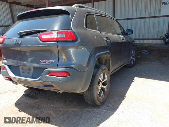 2016 Jeep Cherokee Trailhawk z VIN 1C4PJMBSXGW123829, wystawiony jako IAAI lot #42316140 z przebiegiem 77 730 mil mil oraz . Historia ofert i sprzedaży dostępna na DreamBid. Obrazek 4.