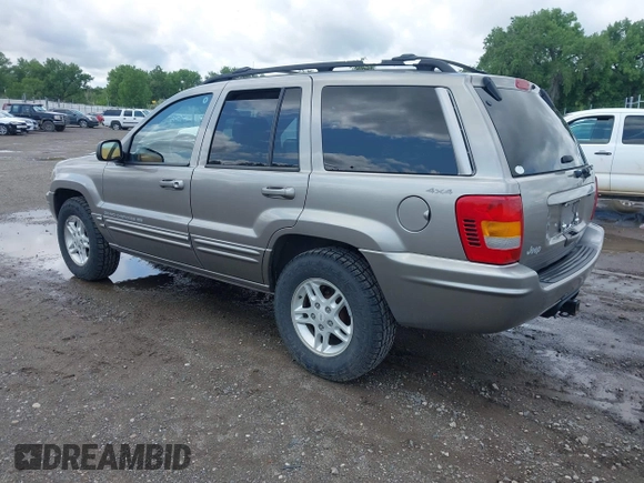 1999 Jeep Grand Cherokee Limited z VIN 1J4GW68N3XC597468, wystawiony jako IAAI lot #42353732 z przebiegiem 201 388 mil mil oraz . Historia ofert i sprzedaży dostępna na DreamBid. Obrazek 3.