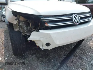 2014 Volkswagen Tiguan SEL with VIN WVGAV3AX7EW022239, listed as a IAAI auction lot 42381670 with 180,729 mi miles and . Bid and sale history available at DreamBid. Image 20.