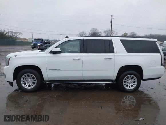 2015 GMC Yukon XL SLT with VIN 1GKS1HKC7FR223513, listed as a IAAI auction lot 40822575 with 128,239 mi miles. Bid and sale history available at carsss.com. Image 14.