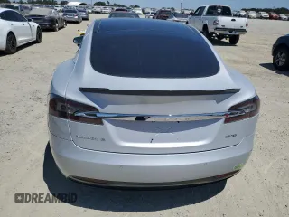 2016 Tesla Model S 90D с VIN 5YJSA1E23GF144496, выставлен на аукционе Copart как лот 64080845 с пробегом 34 847 миль миль и Списание • Salvage title. История ставок и продаж доступна на DreamBid. Изображение 6.