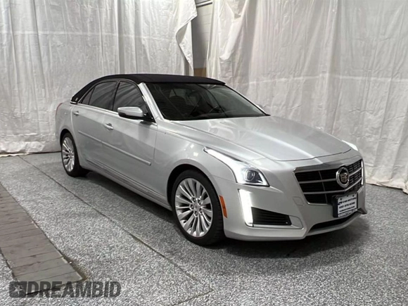 2014 Cadillac CTS Luxury AWD z VIN 1G6AX5S34E0124190, wystawiony jako Copart lot #57848785 z przebiegiem 63 259 mil mil oraz Czysty tytuł • Clean title. Historia ofert i sprzedaży dostępna na DreamBid. Obrazek 1.
