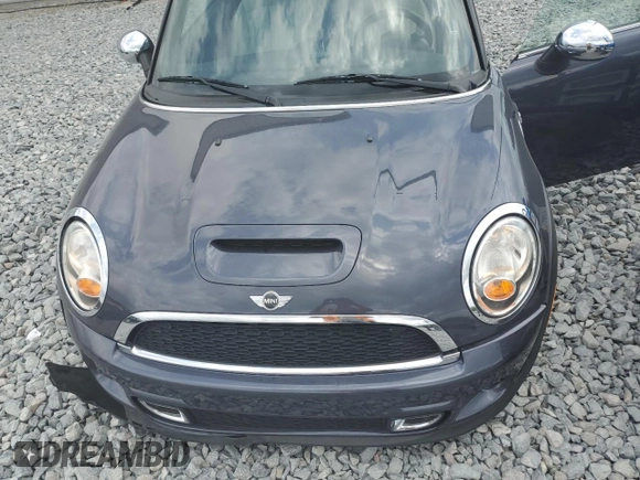 2012 MINI Convertible S with VIN WMWZP3C56CT250886, listed as a Copart auction lot 50027405 with 92,990 mi miles and Salvage title. Bid and sale history available at DreamBid. Image 11.
