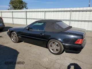 1999 Mercedes-Benz SL-Class with VIN WDBFA68F1XF184891, listed as a Copart auction lot 77082284 with 96,379 mi miles and Salvage Title. Bid and sale history available at carsss.com. Image 2.