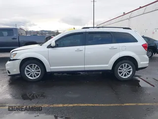 2014 Dodge Journey SXT with VIN 3C4PDCBGXET182430, listed as a IAAI auction lot 41599489 with 143,889 mi miles. Bid and sale history available at carsss.com. Image 14.