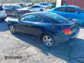 2003 Hyundai Tiburon GT z VIN KMHHN65FX3U076547, wystawiony jako IAAI lot #42015723 z przebiegiem 174 909 mil mil oraz . Historia ofert i sprzedaży dostępna na DreamBid. Obrazek 3.