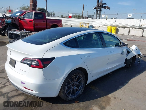 2019 Tesla Model 3 Long Range with VIN 5YJ3E1EB1KF510912, listed as a IAAI auction lot 41857775 with Not Provided miles and . Bid and sale history available at DreamBid. Image 4.