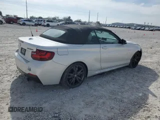 2016 BMW 2 Series M235i with VIN WBA1M1C52GV394052, listed as a Copart auction lot 82261594 with 83,979 mi miles and Salvage Title. Bid and sale history available at carsss.com. Image 3.