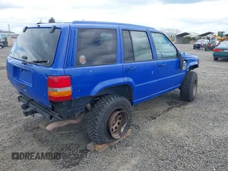 1996 Jeep Grand Cherokee Laredo with VIN 1J4GZ58YXTC329037, listed as a IAAI auction lot 42051175 with 314,571 mi miles and . Bid and sale history available at DreamBid. Image 4.