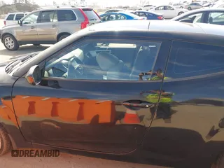 2013 Hyundai Veloster w/Black Int with VIN KMHTC6AD4DU132701, listed as a IAAI auction lot 42021759 with 102,840 mi miles and . Bid and sale history available at DreamBid. Image 14.