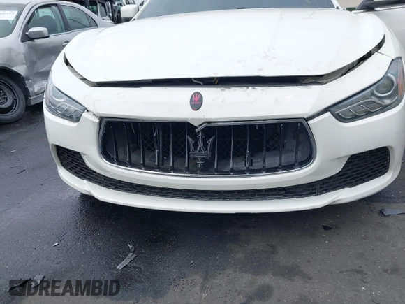 2014 Maserati Ghibli S Q4 with VIN ZAM57RTA3E1090350, listed as a IAAI auction lot 42056682 with 119,160 mi miles and . Bid and sale history available at DreamBid. Image 6.