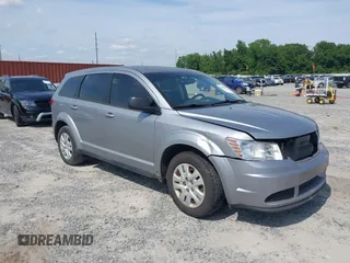 2015 Dodge Journey SE z VIN 3C4PDCAB0FT698674, wystawiony jako IAAI lot #42308994 z przebiegiem 97 640 mil mil oraz . Historia ofert i sprzedaży dostępna na DreamBid. Obrazek 1.