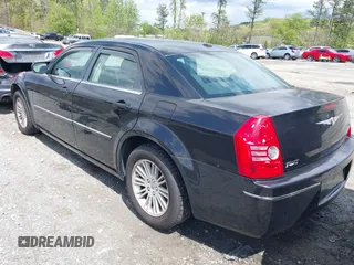 2009 Chrysler 300 Touring with VIN 2C3KA53V99H584082, listed as a IAAI auction lot 42026860 with 147,558 mi miles. Bid and sale history available at carsss.com. Image 3.