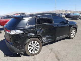 2022 Toyota Corolla Cross LE with VIN 7MUCAABG1NV033299, listed as a Copart auction lot 58018825 with 28,138 mi miles and Salvage title. Bid and sale history available at DreamBid. Image 3.