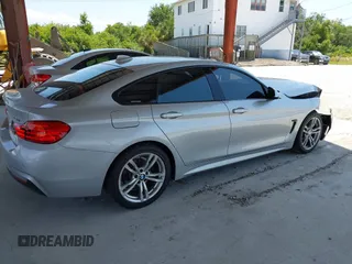 2015 BMW 4 Series 428i with VIN WBA4A5C58FD410076, listed as a IAAI auction lot 39384271 with 125,987 mi miles and . Bid and sale history available at DreamBid. Image 4.