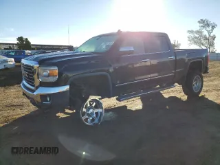 2015 GMC Sierra 2500HD SLT with VIN 1GT12ZE84FF639876, listed as a Copart auction lot 82872324 with 114,175 mi miles and Salvage title. Bid and sale history available at DreamBid. Image 1.