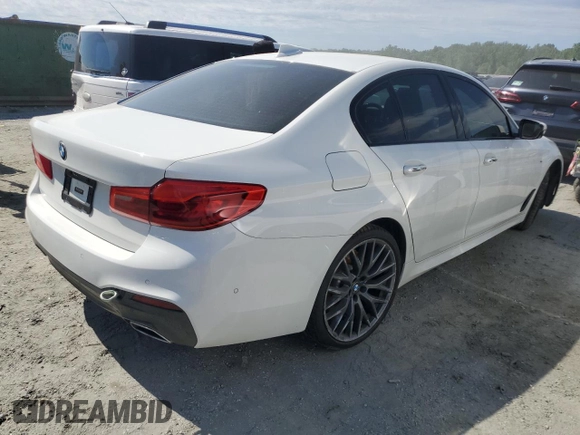2018 BMW 5 Series 540i xDrive with VIN WBAJE7C52JG891212, listed as a Copart auction lot 58119195 with 73,770 mi miles and Salvage title. Bid and sale history available at DreamBid. Image 3.