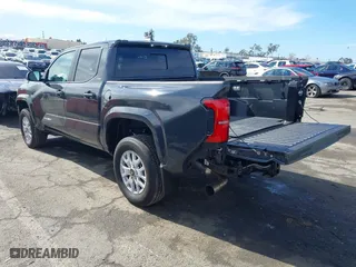 2024 Toyota Tacoma 4WD SR5 with VIN 3TMLB5JN7RM022456, listed as a IAAI auction lot 41430159 with 6,058 mi miles. Bid and sale history available at carsss.com. Image 3.