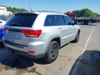 2011 Jeep Grand Cherokee Laredo with VIN 1J4RS4GGXBC513523, listed as a IAAI auction lot 42203802 with 242,239 mi miles and . Bid and sale history available at DreamBid. Image 4.
