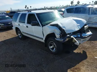 2001 Chevrolet Blazer LT z VIN 1GNCS13W712122865, wystawiony jako IAAI lot #41997035 z przebiegiem 161 862 mil mil oraz . Historia ofert i sprzedaży dostępna na DreamBid. Obrazek 1.