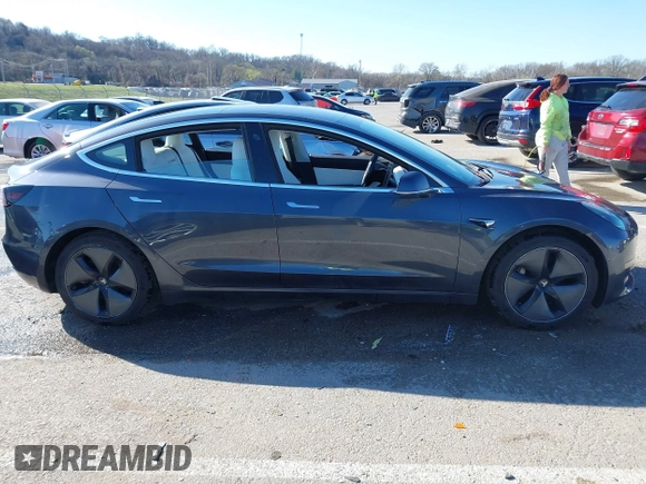 2018 Tesla Model 3 Long Range Battery with VIN 5YJ3E1EB6JF122167, listed as a IAAI auction lot 41761710 with 76,199 mi miles and . Bid and sale history available at DreamBid. Image 13.