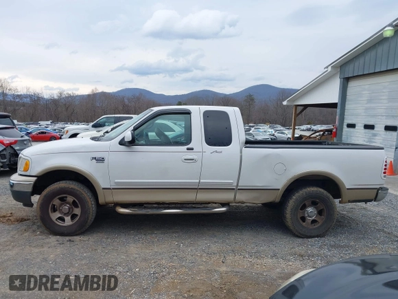 1999 Ford F-150 XL with VIN 1FTRX18LXXKA75357, listed as a IAAI auction lot 41630371 with 202,021 mi miles. Bid and sale history available at carsss.com. Image 15.