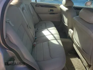1999 Lincoln Town Car Signature z VIN 1LNHM82W7XY626305, wystawiony jako Copart lot #58009475 z przebiegiem Nie podano mil oraz Szkoda całkowita • Salvage title. Historia ofert i sprzedaży dostępna na DreamBid. Obrazek 10.