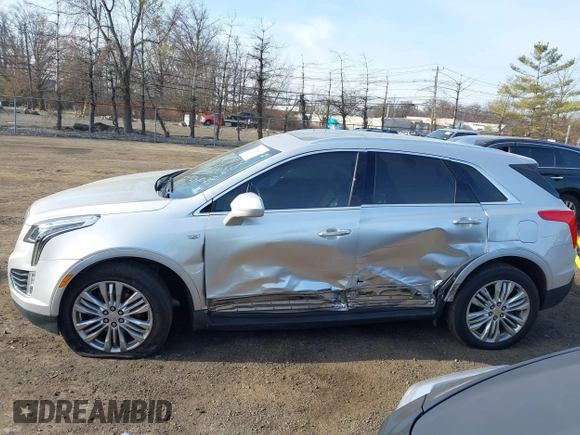 2019 Cadillac XT5 Premium Luxury AWD z VIN 1GYKNFRS2KZ227166, wystawiony jako IAAI lot #41786410 z przebiegiem 99 576 mil mil oraz . Historia ofert i sprzedaży dostępna na DreamBid. Obrazek 14.