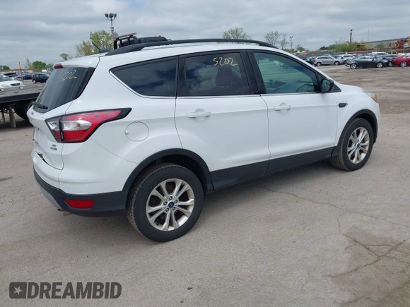 2018 Ford Escape SE z VIN 1FMCU9GDXJUC99453, wystawiony jako IAAI lot #42195202 z przebiegiem 191 840 mil mil oraz . Historia ofert i sprzedaży dostępna na DreamBid. Obrazek 4.