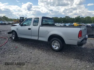 2004 Ford F-150 XL with VIN 2FTRX17W24CA52991, listed as a Copart auction lot 55853095 with 221,452 mi miles and Salvage title. Bid and sale history available at DreamBid. Image 2.