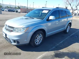 2013 Dodge Journey SXT with VIN 3C4PDCBG5DT674863, listed as a IAAI auction lot 41670225 with 207,524 mi miles. Bid and sale history available at carsss.com. Image 2.